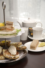 An arrangement of sandwiches and scones for afternoon tea