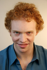 Young man with an evil grin