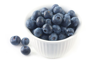 Bowl of blueberries, isolated on white.