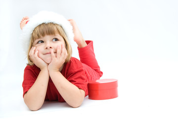 Christmas kid in Santa hat on white background