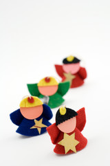 Four christmas figurines on the white background