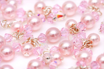 Close up of pink beads of a necklace.