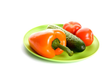vegetables on the plate  isolated on a white background