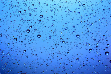 Drops of water on a blue background.