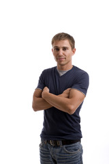 Young casual man posing, isolated over white background