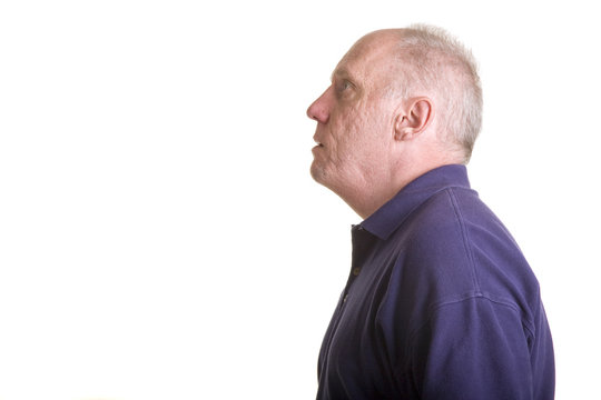 An Older Bald Man Looking Up To The Side