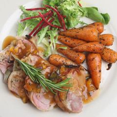 Pork fillet with apricot stuffing and roasted baby carrots