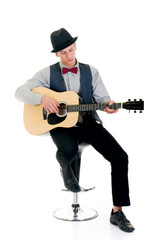 Obraz premium Handsome young male guitar player. Studio shot,