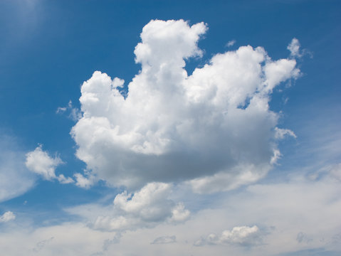 white cloud over deep blue sky background
