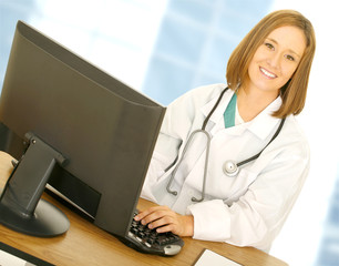 doctor woman work with computer in her modern office - 10041952