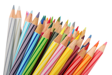 Close up of colorful color pencils over white background.