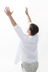 Image of excited man keeping his arms raised