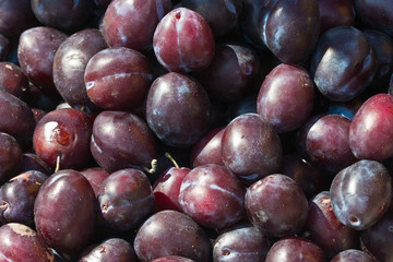 food series: fresh plum texture on market