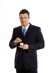 Happy businessman drinking coffee, smiling,