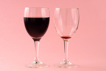 two red wine glasses, filled and empty