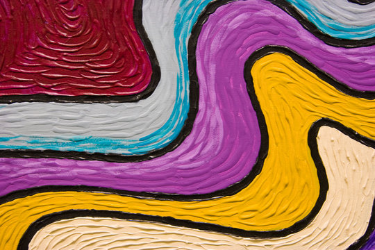 Swooshes of colorful textured paint looking like a rainbow