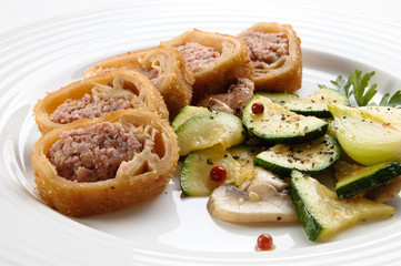 Stuffed fried pancakes with meat and vegetable salad