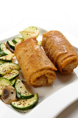 Stuffed fried pancakes with meat and vegetable salad