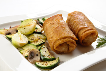 Stuffed fried pancakes with meat and vegetable salad