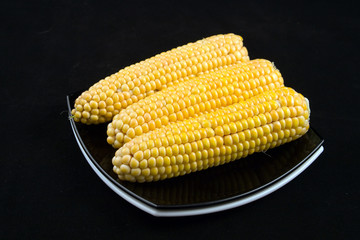 corns on a black background