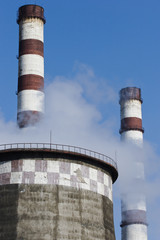 smoking factory pipes and blue sky