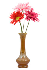 Three red flowers in a vase isolated on white