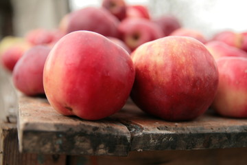 Red apples on table