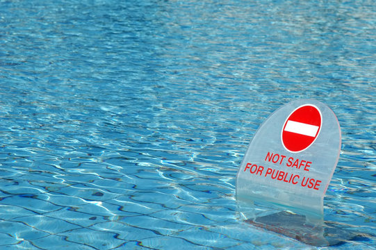warning sign in a public swimming pool