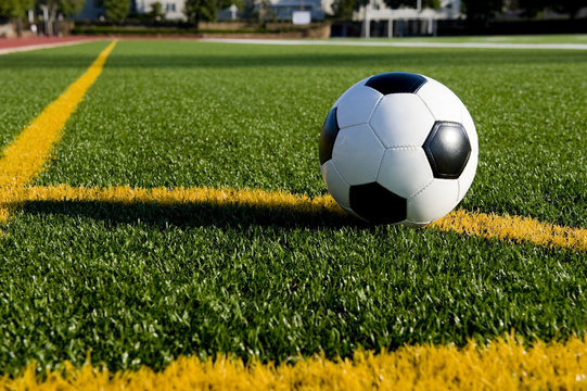 A soccer ball or football on a soccer field