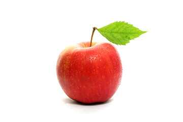 Red wet apple with leaf isolated on white