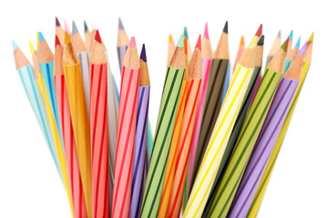 Fototapeta premium Close up of colorful color pencils over white background.