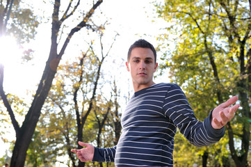 Handsome young man  outside in nature