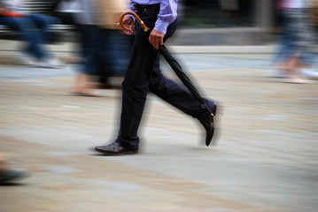 Obraz premium Motion effect applied to man in busy highstreet