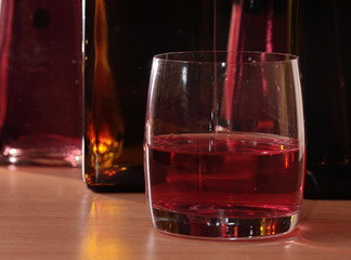 Bottles and glass with alcoholic drinks