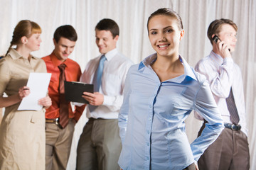 Pretty lady standing and looking at camera