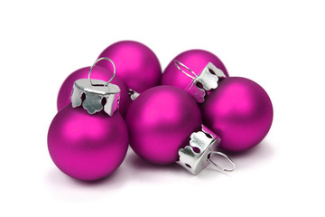 Pink christmas balls over white background with clipping path.