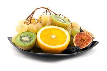 fresh fruits on a plate  isolated on a white background