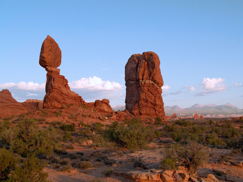 Man hiking by the Balanced rock at the Arches national park