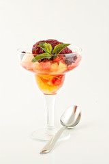 Sweet dessert with ice cream and fruits.