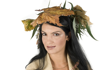 Beautiful women with crown of autumn leafs on head