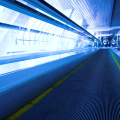 Blue moving escalator in the office hall perspective view