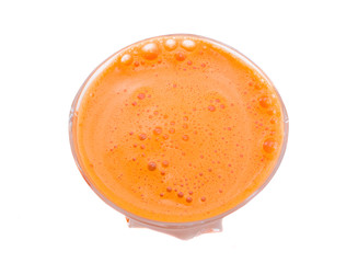 Glass of carrot juice the top view isolated on the white