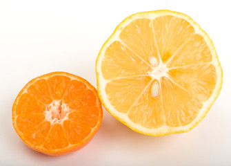 Sliced mandarin and lemon on white