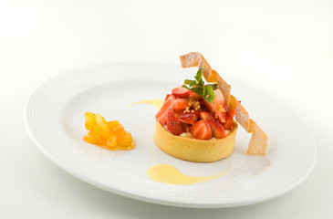 Sweet dessert with strawberries, on white, studio shot.