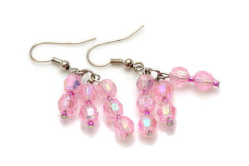 A pair of pink bead earrings isolated on white background.