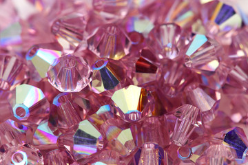Close up of a pile of light purple beads.