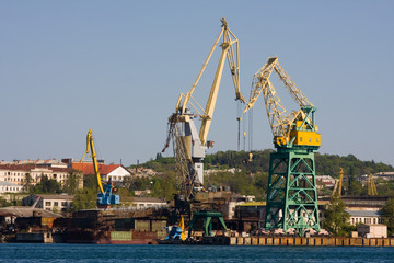 Fototapeta na wymiar Cranes in port of the city Sevastopol