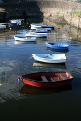 Fototapeta na wymiar Rowboats sitting in the harbour waiting to go fishing