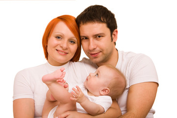 Happy family - father, mother and their cute little baby