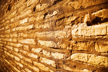 Ancient stone wall. Wide angle view and red tint.